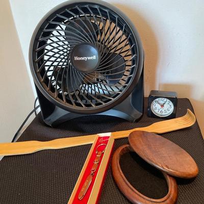 Fan, key chain, clock, back scratcher