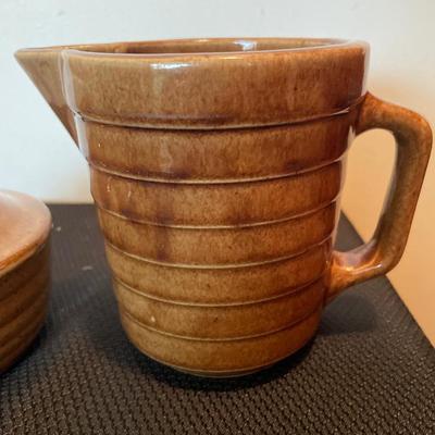 Brown stoneware soup and pitcher
