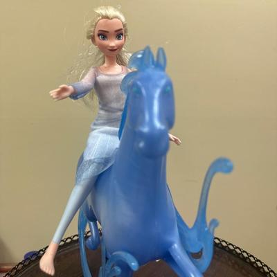 Frozen horse and doll