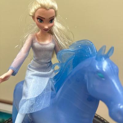 Frozen horse and doll