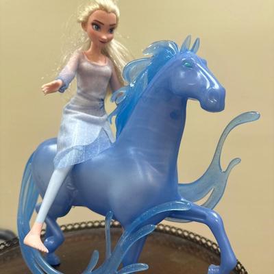 Frozen horse and doll