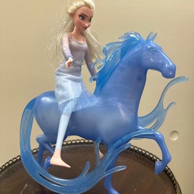 Frozen horse and doll