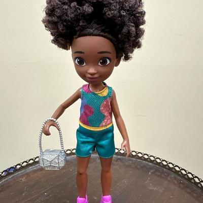 Doll with purple shoes