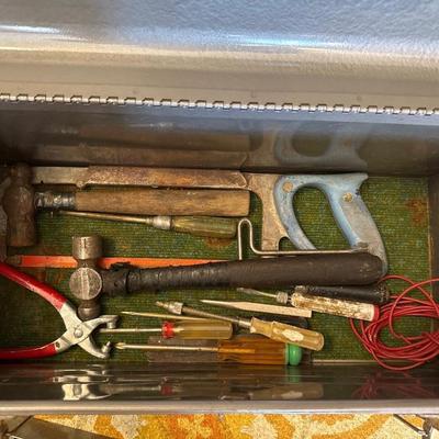 Gray metal craftsman toolbox with hand tools