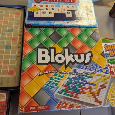 Assortment Of Games Dominoes Othello Scrabble Blokus Rummikub (G)