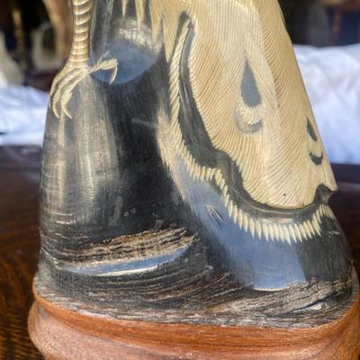 Carved horn bird on wood base