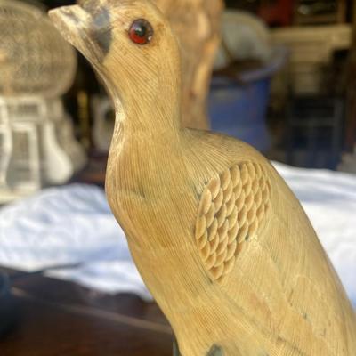 Carved horn bird on wood base