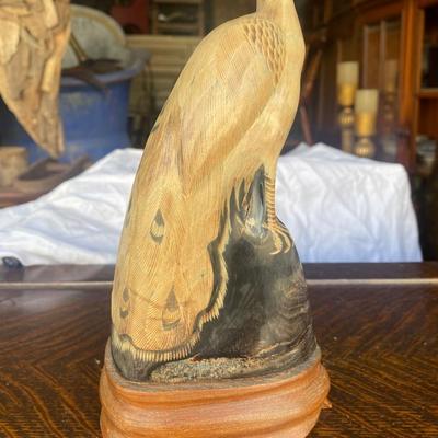 Carved horn bird on wood base