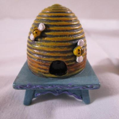 The Fairy Garden beehive , by Mary Engelbreit; beehive on a stick