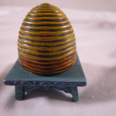 The Fairy Garden beehive , by Mary Engelbreit; beehive on a stick