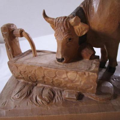 Hand-carved wooden cow sculpture