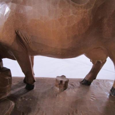 Hand-carved wooden cow sculpture