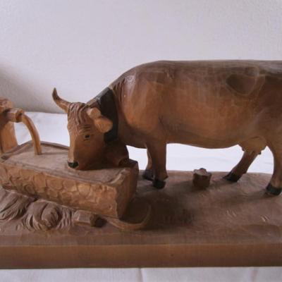 Hand-carved wooden cow sculpture