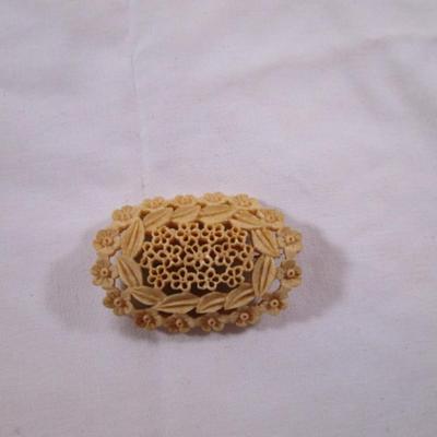 Antique carved bovine bone brooch