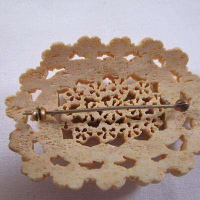 Antique carved bovine bone brooch