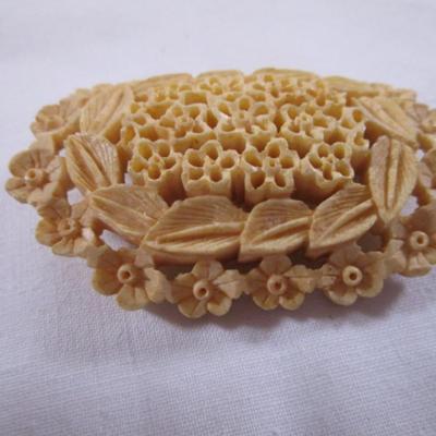 Antique carved bovine bone brooch