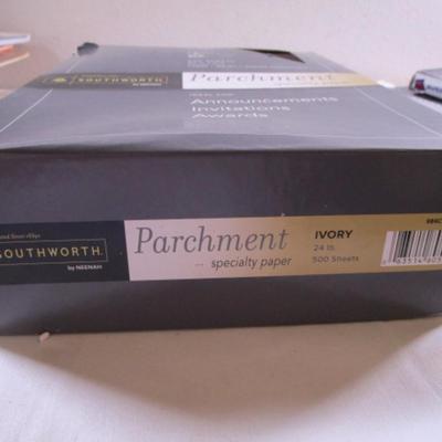 1 box parchment resume paper, 2 boxes of sheet protectors, notebook