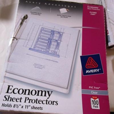 1 box parchment resume paper, 2 boxes of sheet protectors, notebook