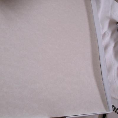 1 box parchment resume paper, 2 boxes of sheet protectors, notebook