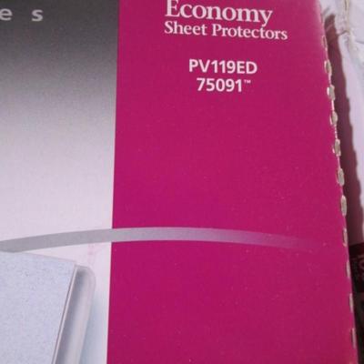 1 box parchment resume paper, 2 boxes of sheet protectors, notebook