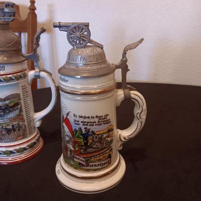 2 GERMAN STEINS WITH PEWTER TOPS