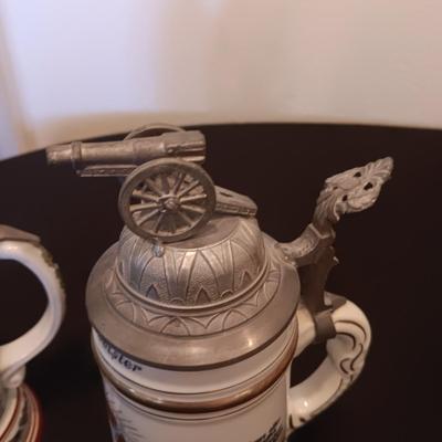 2 GERMAN STEINS WITH PEWTER TOPS