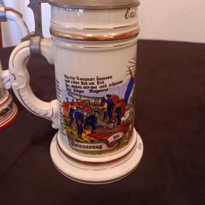 2 GERMAN STEINS WITH PEWTER TOPS