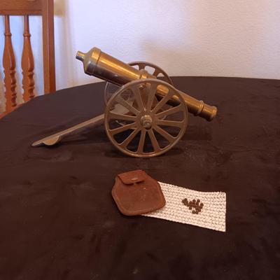 BRASS MODEL CANNON AND VINTAGE LEATHER POUCHW/LEAD PELLETS