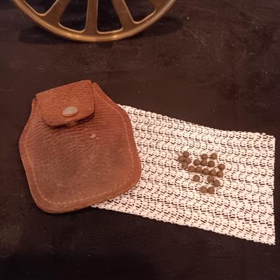 BRASS MODEL CANNON AND VINTAGE LEATHER POUCHW/LEAD PELLETS