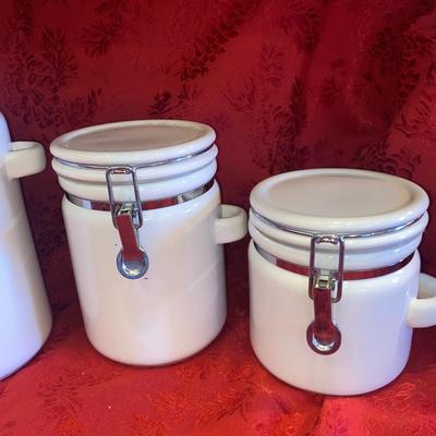 PREFERRED STOCK, CANISTERS AND LARGE PLASTIC CANISTER