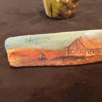 HAND PAINTED CLAY JUG AND WYOMING BACK SCRATCHER MADE FROM AN ANIMAL BONE