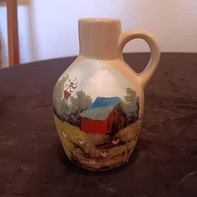 HAND PAINTED CLAY JUG AND WYOMING BACK SCRATCHER MADE FROM AN ANIMAL BONE
