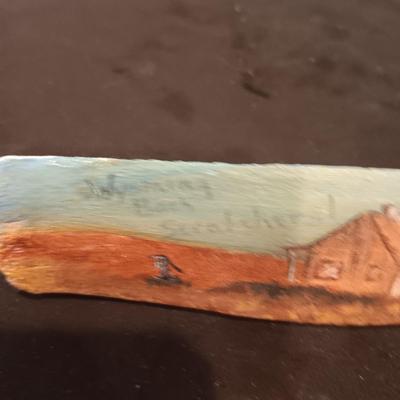 HAND PAINTED CLAY JUG AND WYOMING BACK SCRATCHER MADE FROM AN ANIMAL BONE