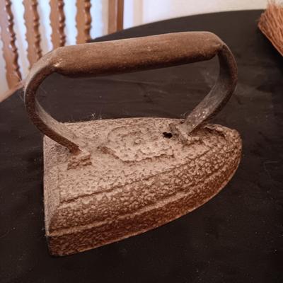 2 VINTAGE CAST IRONS AND A HANDCRAFTED BROOM