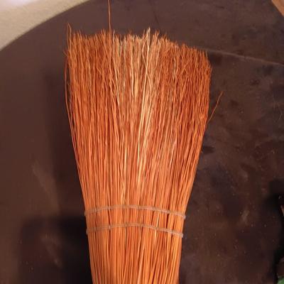 2 VINTAGE CAST IRONS AND A HANDCRAFTED BROOM