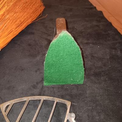 2 VINTAGE CAST IRONS AND A HANDCRAFTED BROOM