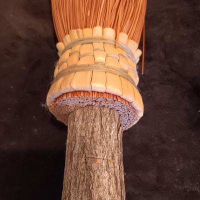 2 VINTAGE CAST IRONS AND A HANDCRAFTED BROOM