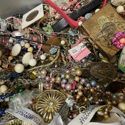 Box of assorted jewelry pieces