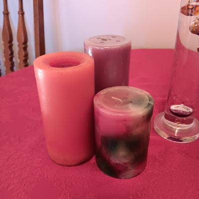 GALILEO THERMOMETER AND SEVERAL CANDLES