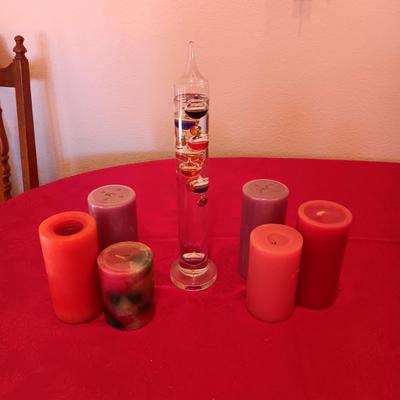 GALILEO THERMOMETER AND SEVERAL CANDLES