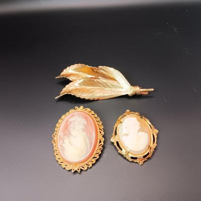 CAMEOS AND GOLD TONE LEAF BROOCHES