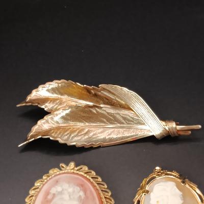 CAMEOS AND GOLD TONE LEAF BROOCHES