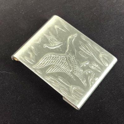 With an embossed hunting motif of ducks on the wing here is a vintage aluminum paper matchbook cover or matchsafe...2 1/8" by 1...