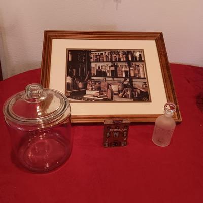 SIGNED "THE APOTHECARY" FRAMED PICTURE AND CONTAINERS PLUS AN APOTHECARY STORE MADE FROM A BRICK