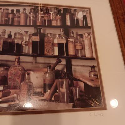 SIGNED "THE APOTHECARY" FRAMED PICTURE AND CONTAINERS PLUS AN APOTHECARY STORE MADE FROM A BRICK