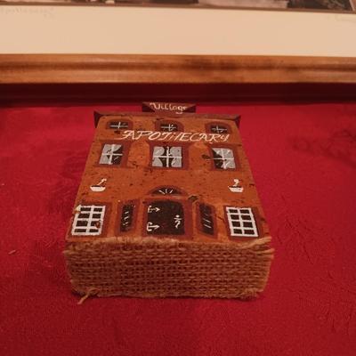 SIGNED "THE APOTHECARY" FRAMED PICTURE AND CONTAINERS PLUS AN APOTHECARY STORE MADE FROM A BRICK