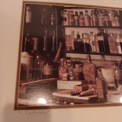 SIGNED "THE APOTHECARY" FRAMED PICTURE AND CONTAINERS PLUS AN APOTHECARY STORE MADE FROM A BRICK