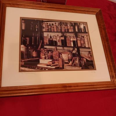 SIGNED "THE APOTHECARY" FRAMED PICTURE AND CONTAINERS PLUS AN APOTHECARY STORE MADE FROM A BRICK