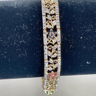 Sale Photo Thumbnail #538: With sapphire, ruby and emerald accents. 7 1/4” long with secure clasp. Excellent condition.