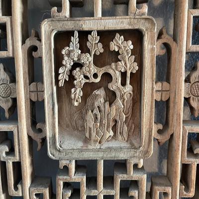 Sale Photo Thumbnail #21: 32"h x 12"w x 1.5"d
This is an antique Chinese shutter carved out of elmwood. It is richly carved with fretwork surrounding a central panel featuring a flowering tree. It comes with customs stamps and a COA attesting to its antique state.